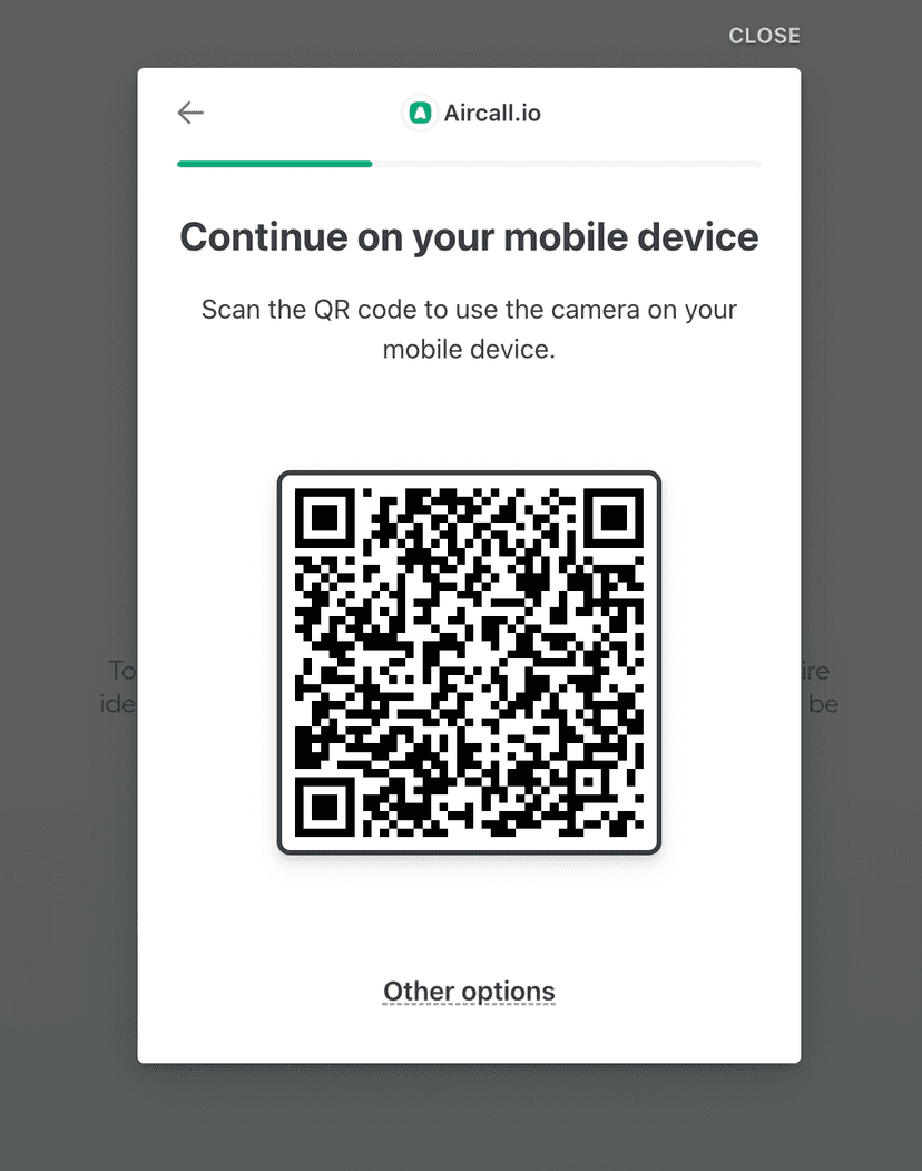 Pop-up of a QR code with text above reading, "Continue on your mobile device, scan the QR code to use the camera on your mobile device"